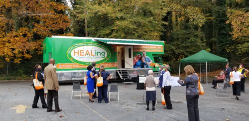 Health equity leadership by Charles Moore with HEALing Community Center mobile clinic